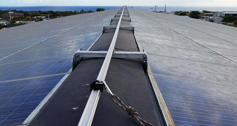 VERTIC's ALTIRAIL horizontal fall protection rail system on photovoltaic panels